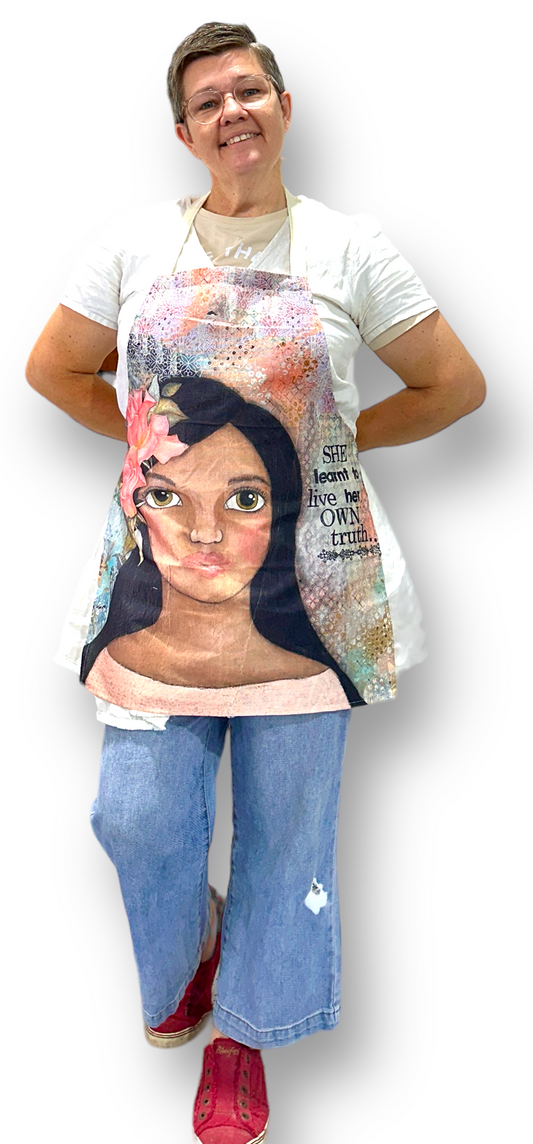whimsy and me, multi colored, soft pink, vintage tones, island girl, mixed media, girl, brunette, framed, recycled frame, hazel eyes, whimsical girl, flowers, vintage wallpaper, learning her truth, original artwork, adults apron