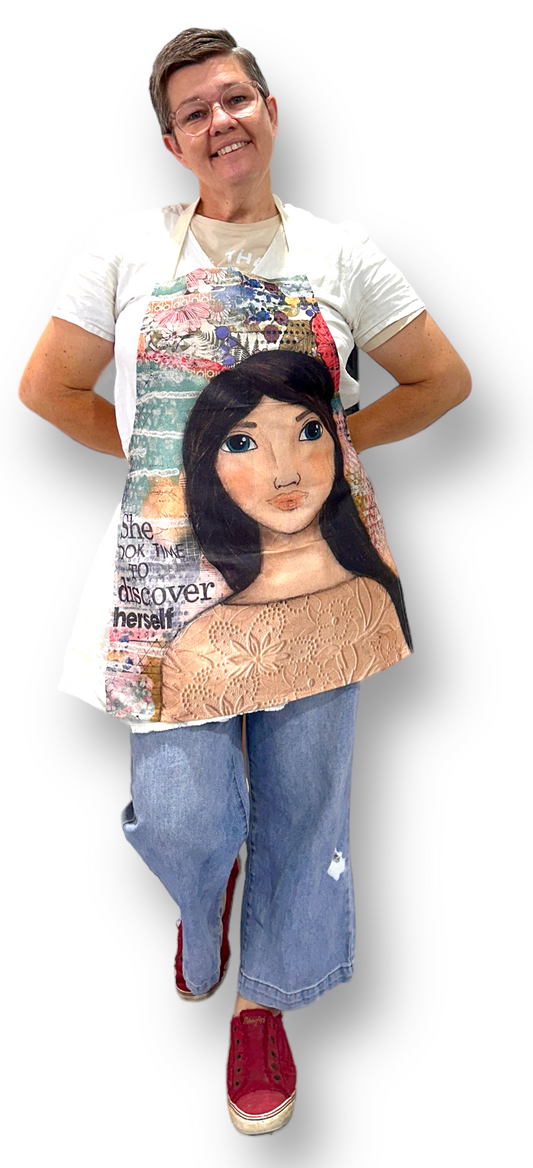 whimsy and me, multi colored, mixed media, girl, brunette, framed, recycled frame, blue eyes, whimsical girl, flowers, vintage wallpaper, discovering, adults apron